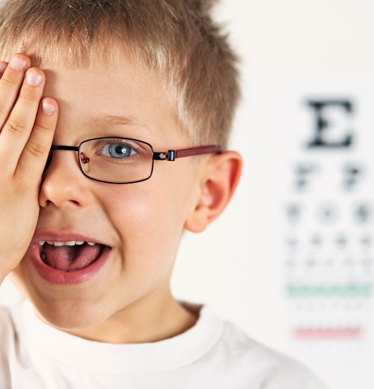 child-covering-eye-during-vision-test