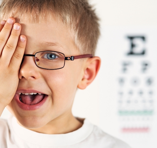 child-covering-eye-during-vision-test