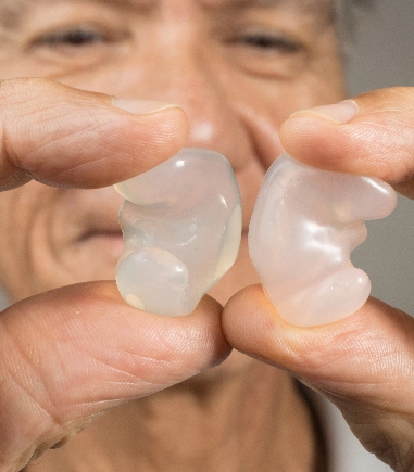man-holding-custom-plug-earmolds