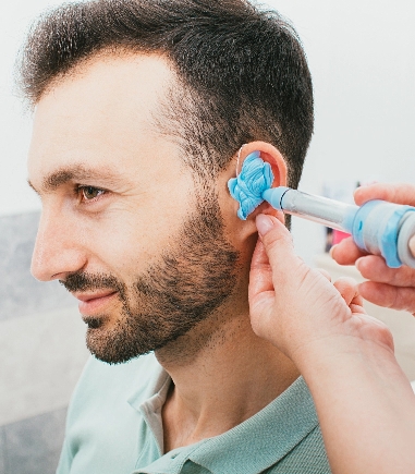 taking-ear-impression-for-custom-hearing-plugs